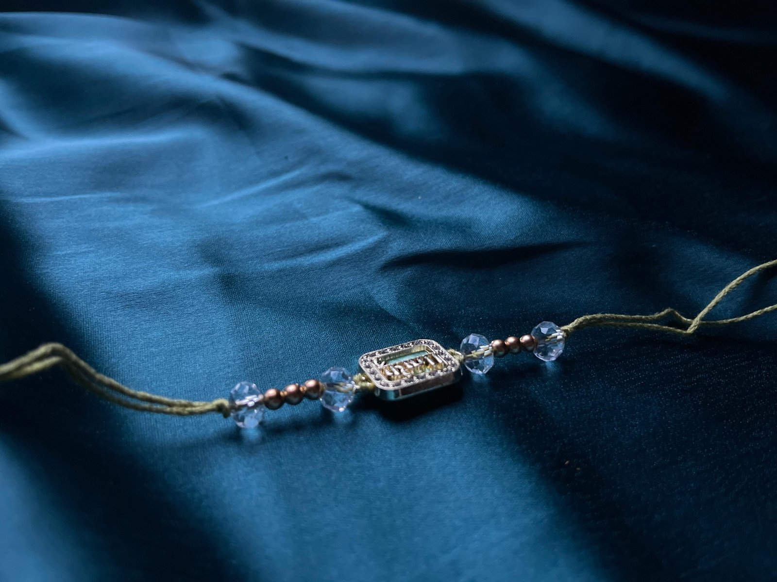Elegant Crystal-Beaded Rakhi Bracelet - Gold-Plated with Om Motif - Image 3