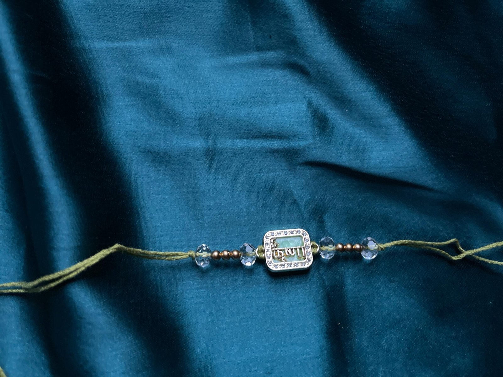 Elegant Crystal-Beaded Rakhi Bracelet - Gold-Plated with Om Motif - Image 4